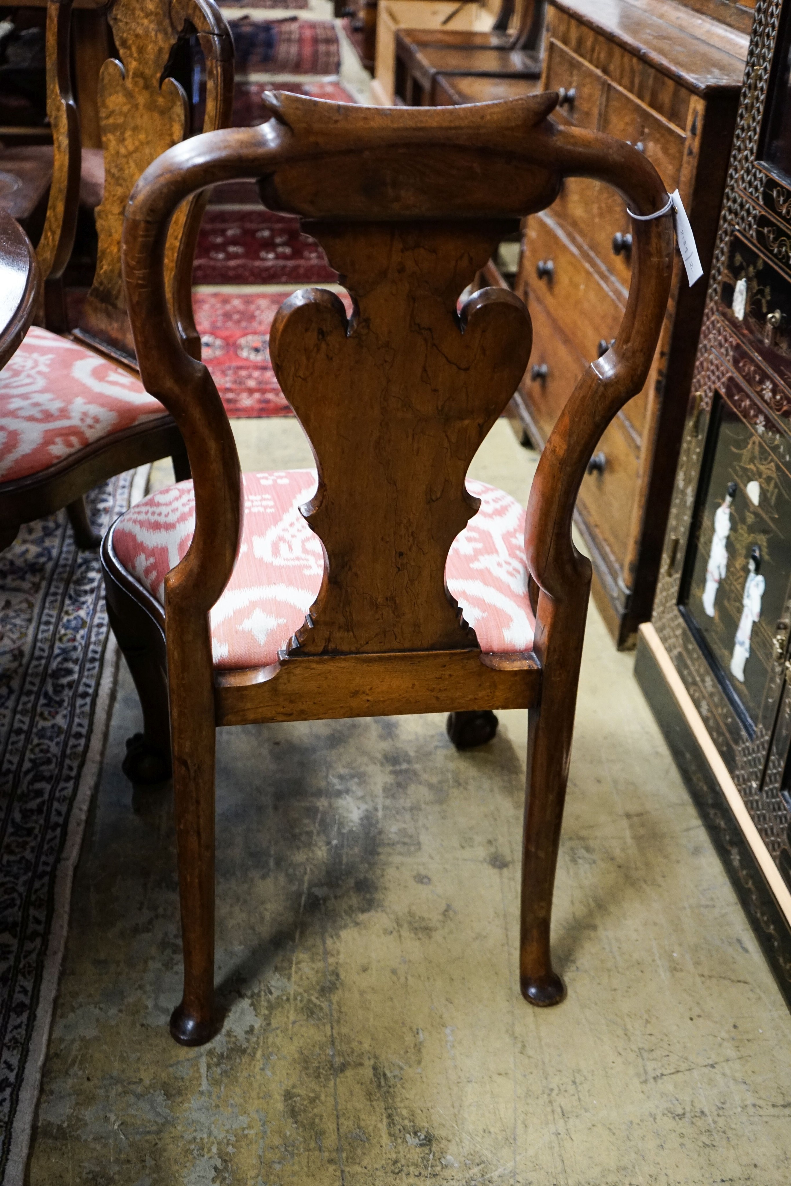 A set of four Queen Anne revival walnut dining chairs